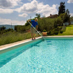 Cleaning the pool for a sunny and lazy day.Related images;