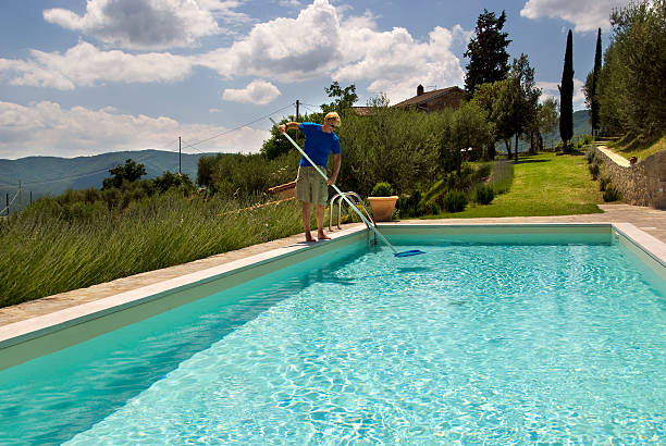 Cleaning the pool for a sunny and lazy day.Related images;