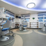Modern corporate dental office with multiple treatment rooms and digital dental equipment