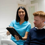 Patient comparing dental treatment cost estimates from Aspen Dental and a private dentist office**