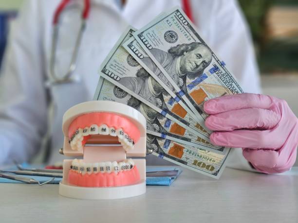 Dentist with dollar bills